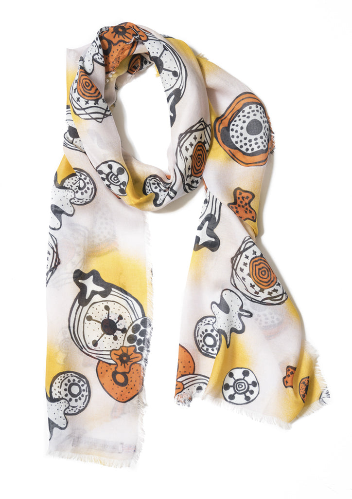 White, orange and black graphic design on cashmere modal scarf