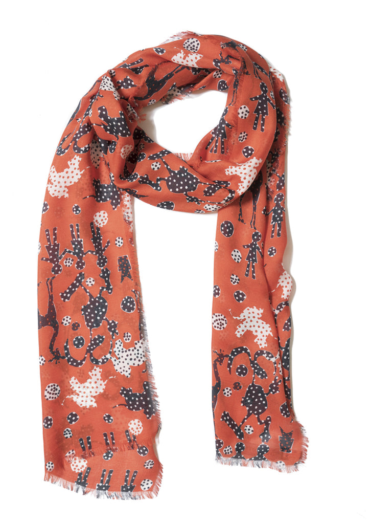 On red, patterned, cashmere modal scarf with fringed edge